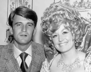 Black and white archival photo of Dolly Parton and her late husband Carl Dean, highlighting their six-decade marriage and caregiver devotion.